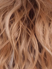 PEACHES-AND-CREAM | A vibrant peach blonde with creamy undertones and bright, face-framing cream highlights. Rich chocolate root adds depth.